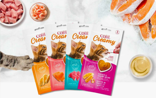 Creamy cat treats lineup ingredients background
